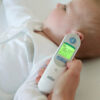 Braun ThermoScan 7 ear thermometer being used on a child